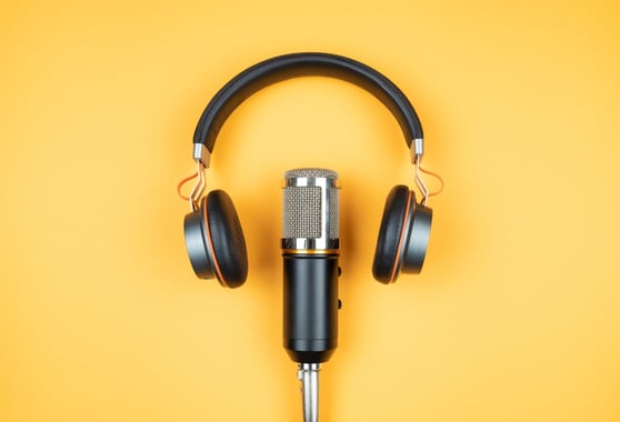 Microphone and headphones in a yellow background.