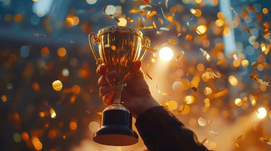 Businessman holding champion golden trophy for winner